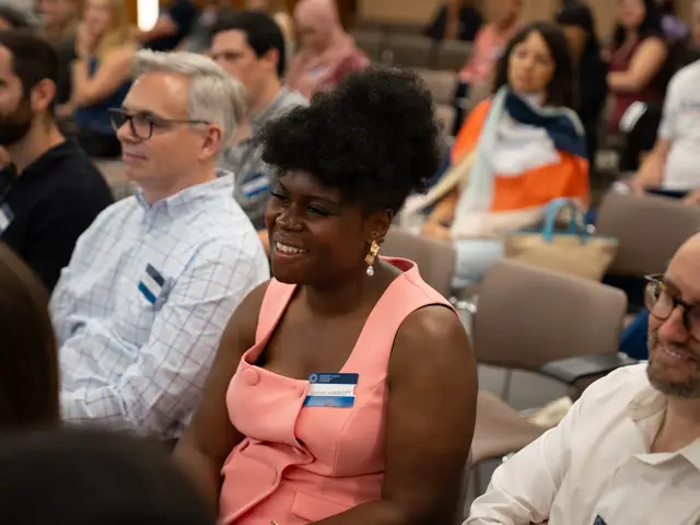Guests laughing at the Q2 2026 launch